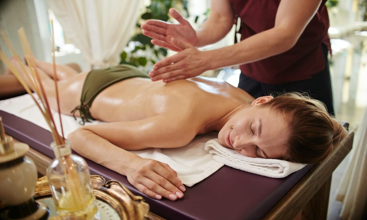 smiling-woman-enjoying-massage-in-spa